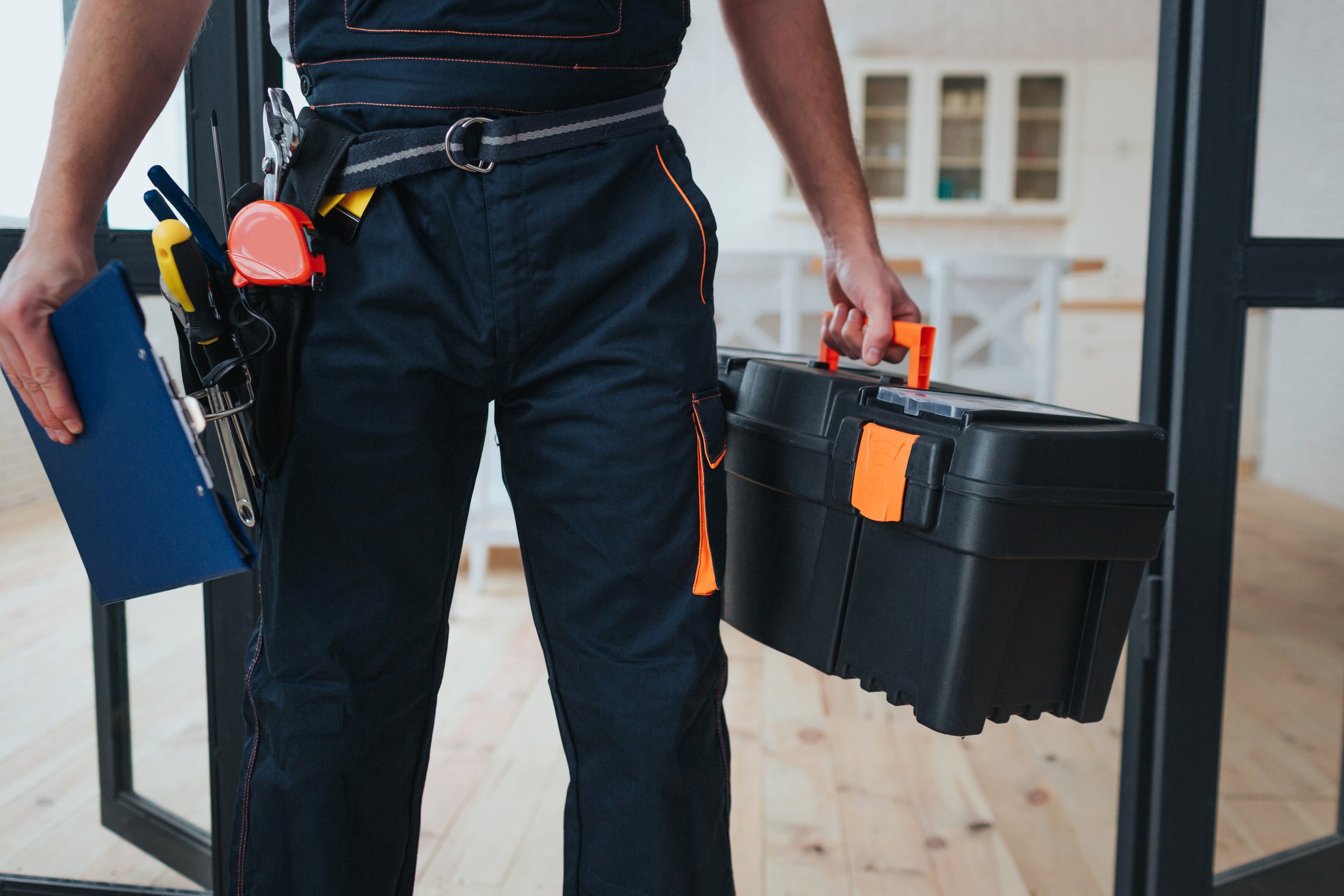 Cut View of Handyman Holding Tool Box